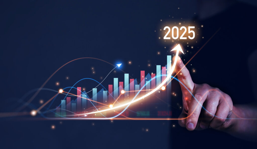 Business person draws increase arrow graph to show growth for the year 2025.